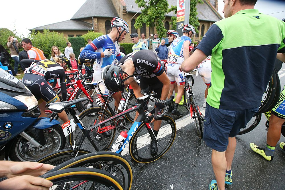 Riders pick themselves up following a crash 25km from the finish during stage 5