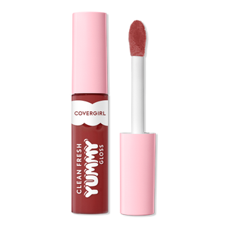 closed Clean Fresh Yummy Lip Gloss Daylight Collection beside its applicator on a gray background
