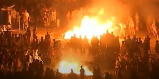 Woodstock '99 attendees start large fires on the final night