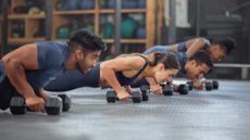 Group of people working out with dumbbells