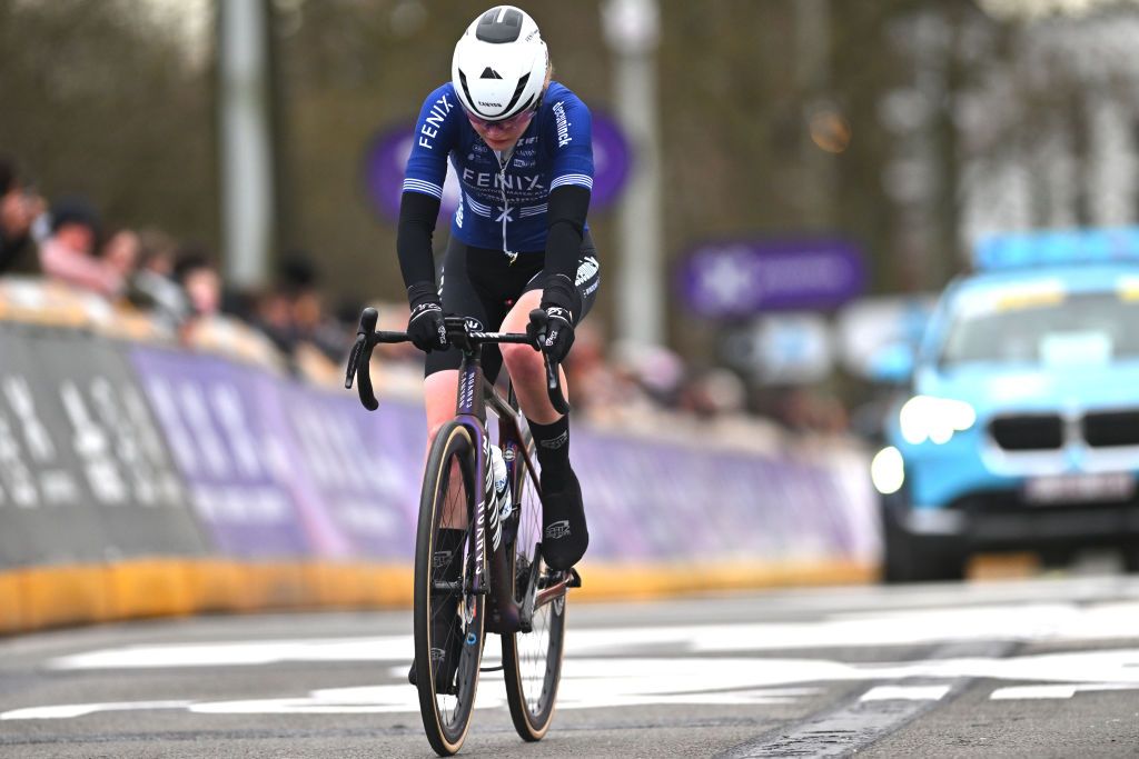 NINOVE BELGIUM FEBRUARY 24 Puck Pieterse of The Netherlands and Team FenixDeceuninck crosses the finish line during the 16th Omloop Het Nieuwsblad 2024 Womens Elite a 1271km one day race from Ghent to Ninove UCIWWT on February 24 2024 in Ninove Belgium Photo by Luc ClaessenGetty Images