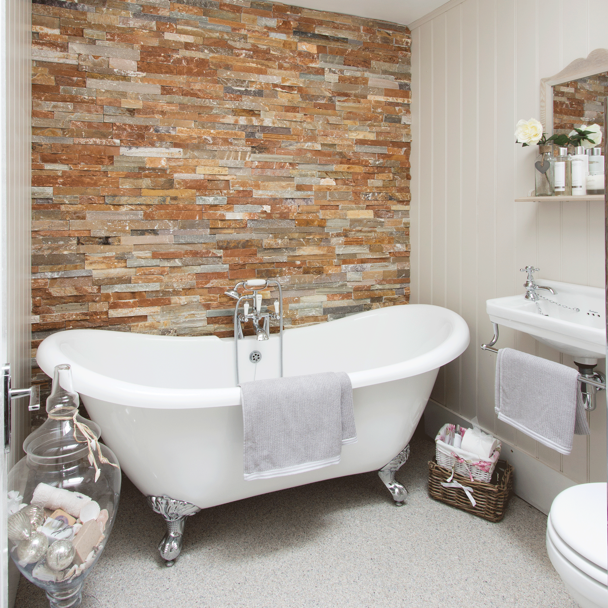 White bathtub with red brick wall