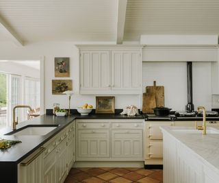 kitchen with white cabinetry and black counters