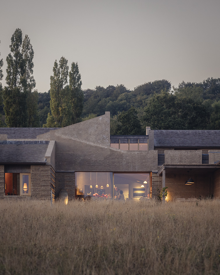 view of Rammed Earth House by Tuckey Design Studio with tactile walls and earth tones