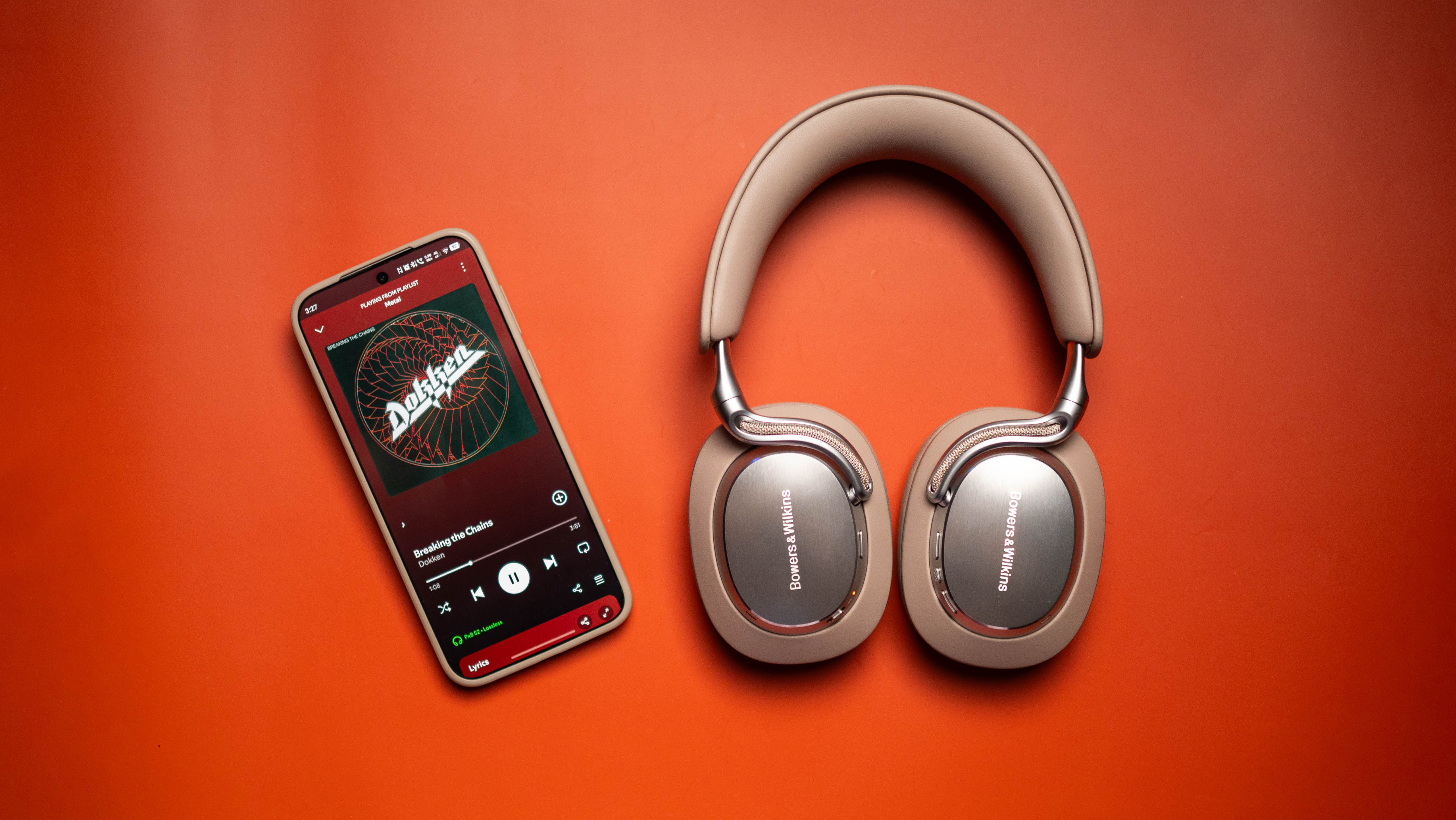 Bowers &amp; Wilkins Px8 S2 headset next to Vivo X300 Pro with Spotify