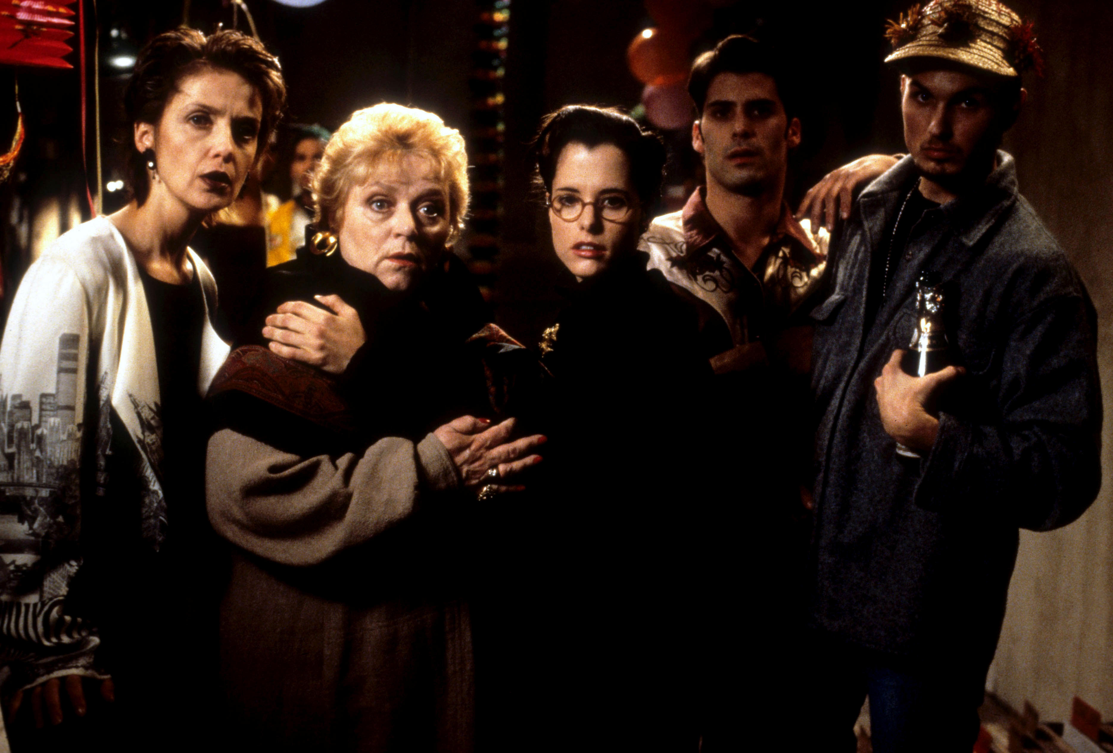 two librarians mary and some of her friends look surprised at a party in the final party scene of the movie party girl