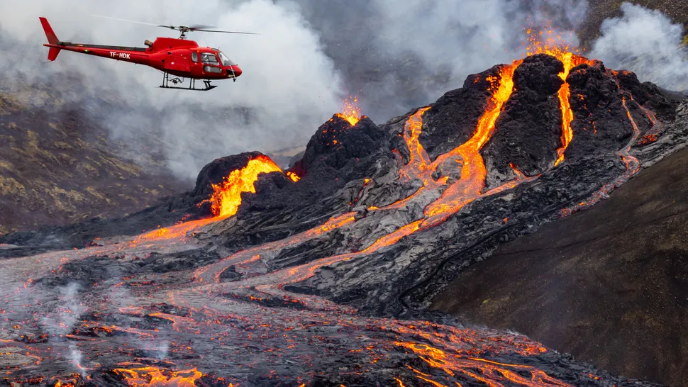 A helicopter flies over the eruption. (Image credit: Vilhelm Gunnarsson via Getty Images)