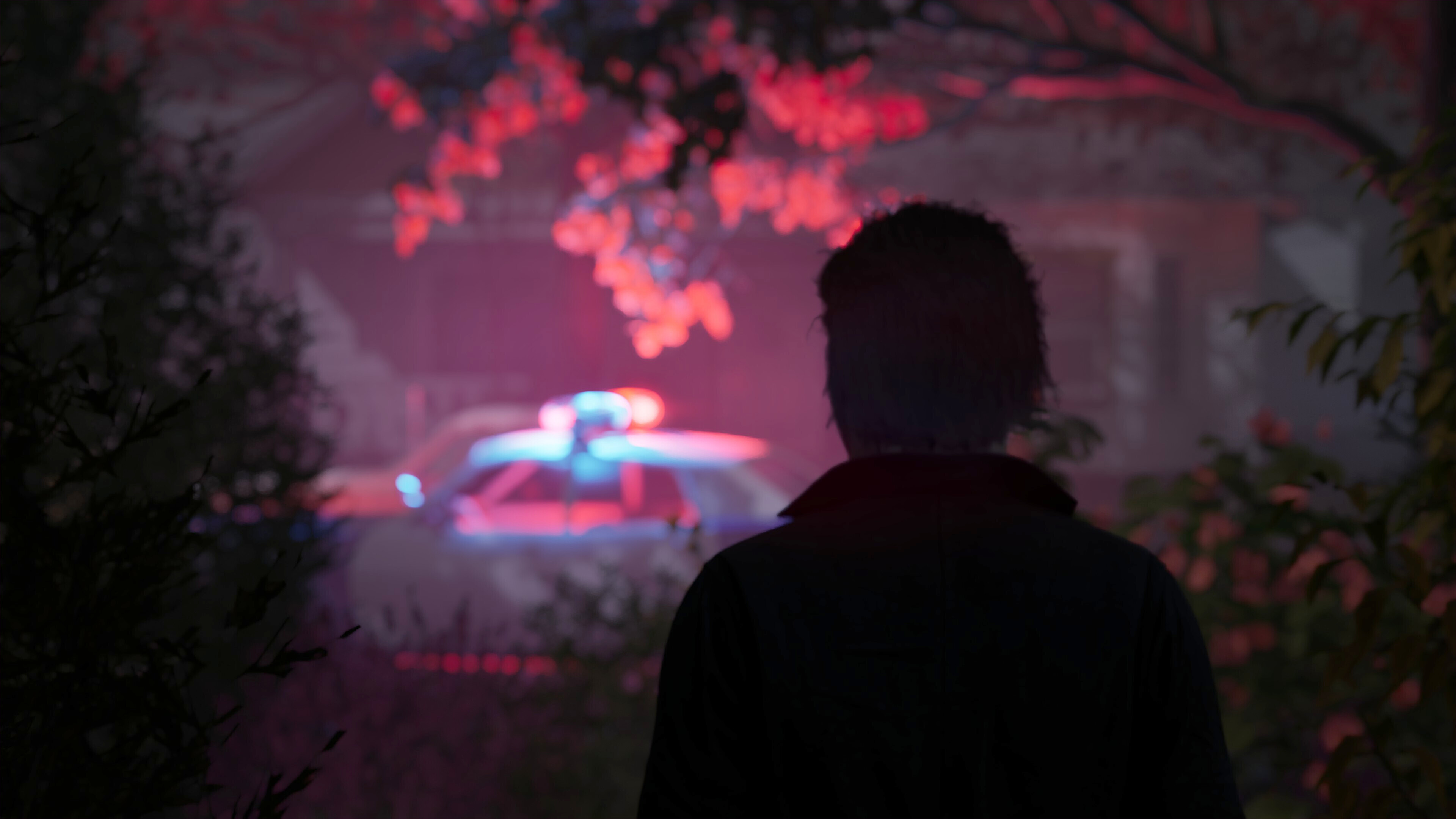 Michael Myers ominously looks at a town scene.
