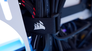 Corsair iCUE 5000T RGB mid-tower PC case with RGB lighting enabled in blue and pink