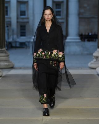 Model on the runway at London Fashion Week S/S 2023 wearing Erdem