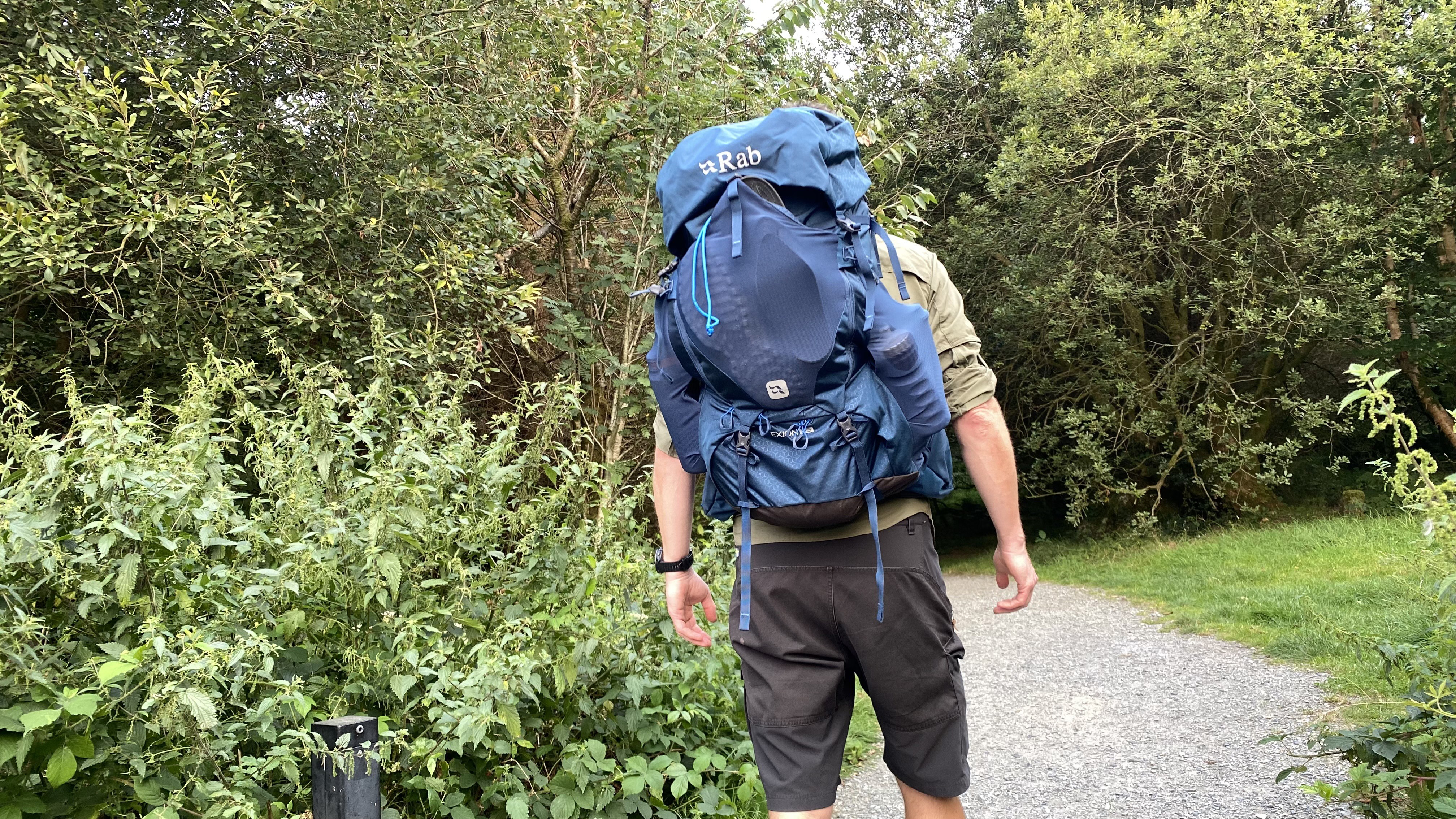 Hiker wearing the Rab Exion 55 Backpack