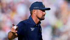 Bryson DeChambeau waves to the crowd