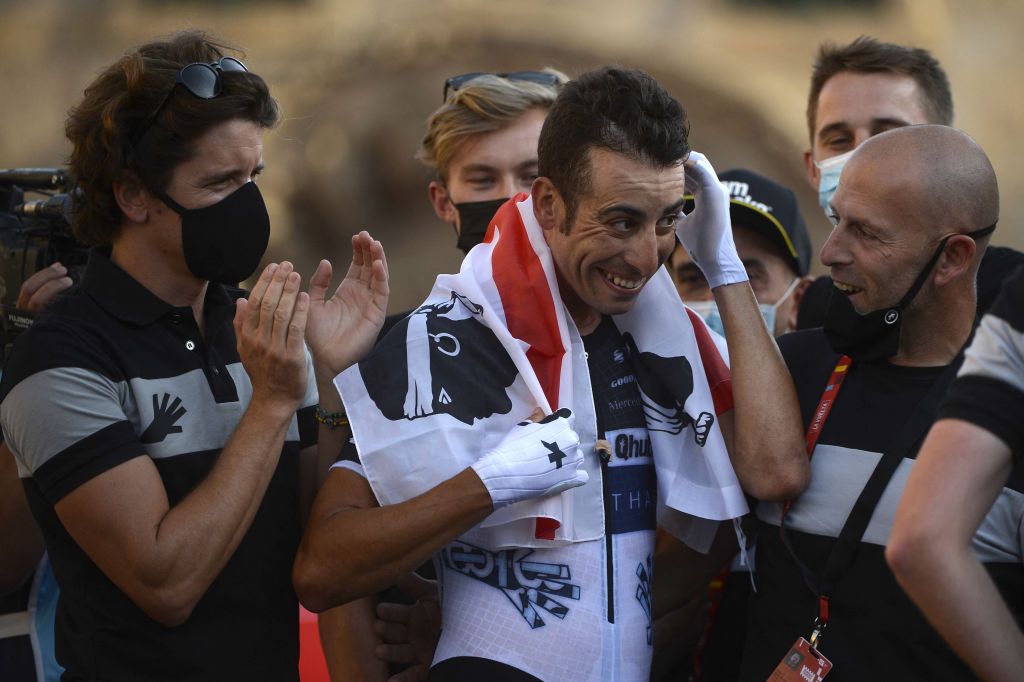 Team Qhubeka Nexthashs Italian rider Fabio Aru C is applauded by teammates after riding the 21st and final stage of the 2021 La Vuelta cycling tour of Spain a 338 km timetrial race from Padron to Santiago de Compostela on September 5 2021 Photo by MIGUEL RIOPA AFP Photo by MIGUEL RIOPAAFP via Getty Images