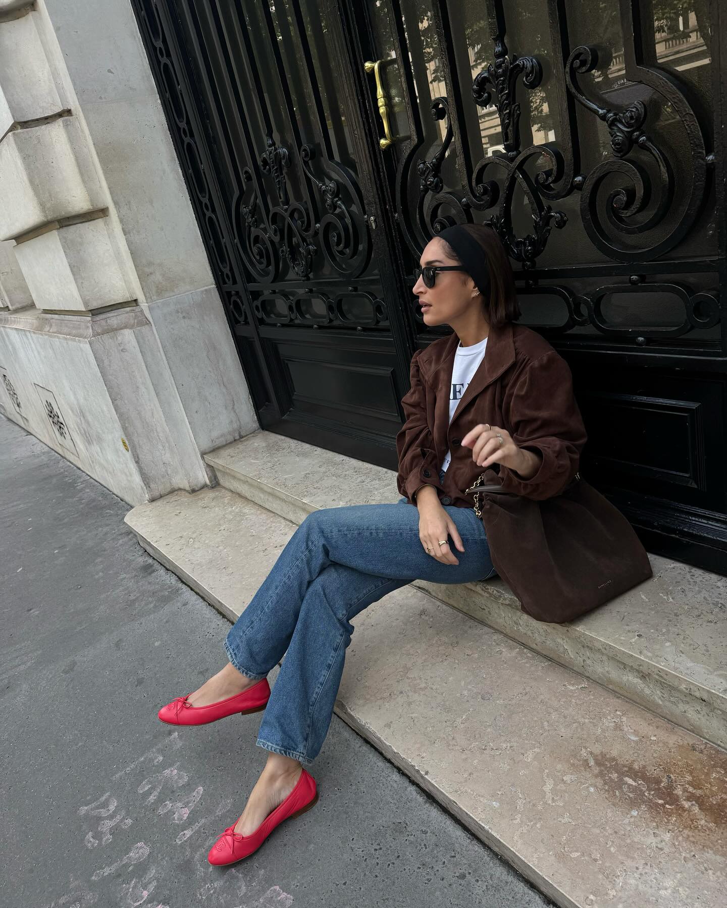 erin off duty wears a suede jacket, white t-shirt, jeans and ballet flats
