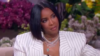 Kelly Rowland looking to her right on The Jennifer Hudson show.