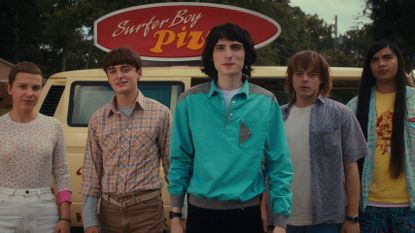 Millie Bobby Brown as Eleven, Noah Schnapp as Will Byers, Finn Wolfhard as Mike Wheeler, Charlie Heaton as Jonathan Byers, and Eduardo Franco as Argyle in STRANGER THINGS