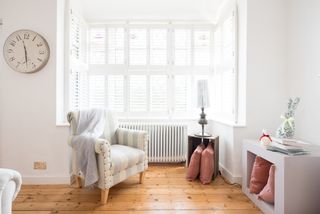 white living room with white cast iron radiator
