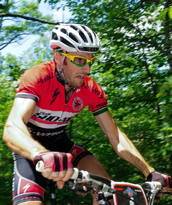 Sid Taberlay (Sho-Air/Specialized) wrestles his bike through a rock garden.
