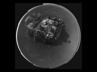 This Picasso-like self portrait of NASA's Curiosity rover was taken by its Navigation cameras, located on the now-upright mast. The camera snapped pictures 360-degrees around the rover, while pointing down at the rover deck, up and straight ahead. Only 2 tiles are high-resolution at this point. (Released Aug. 8, 2012)
