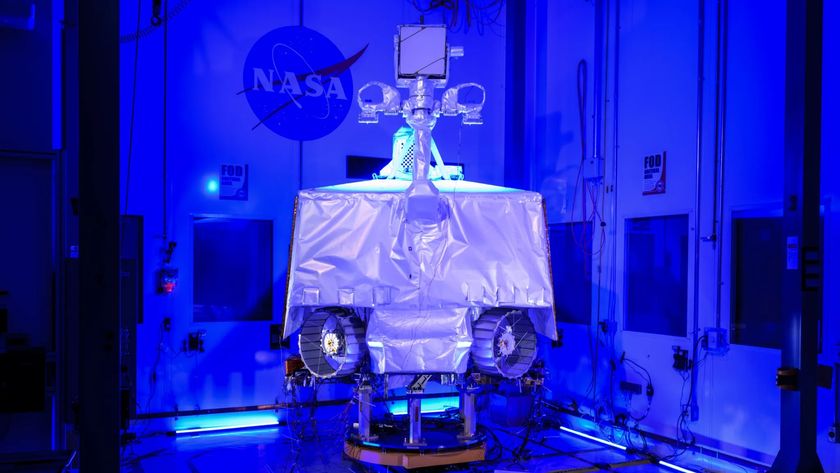 a four-wheeled robot in a cleanroom under UV lights