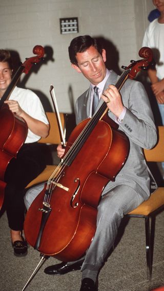 King Charles playing a Cello
