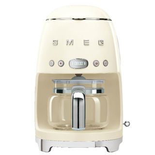 smeg drip coffee machine in cream on a white background