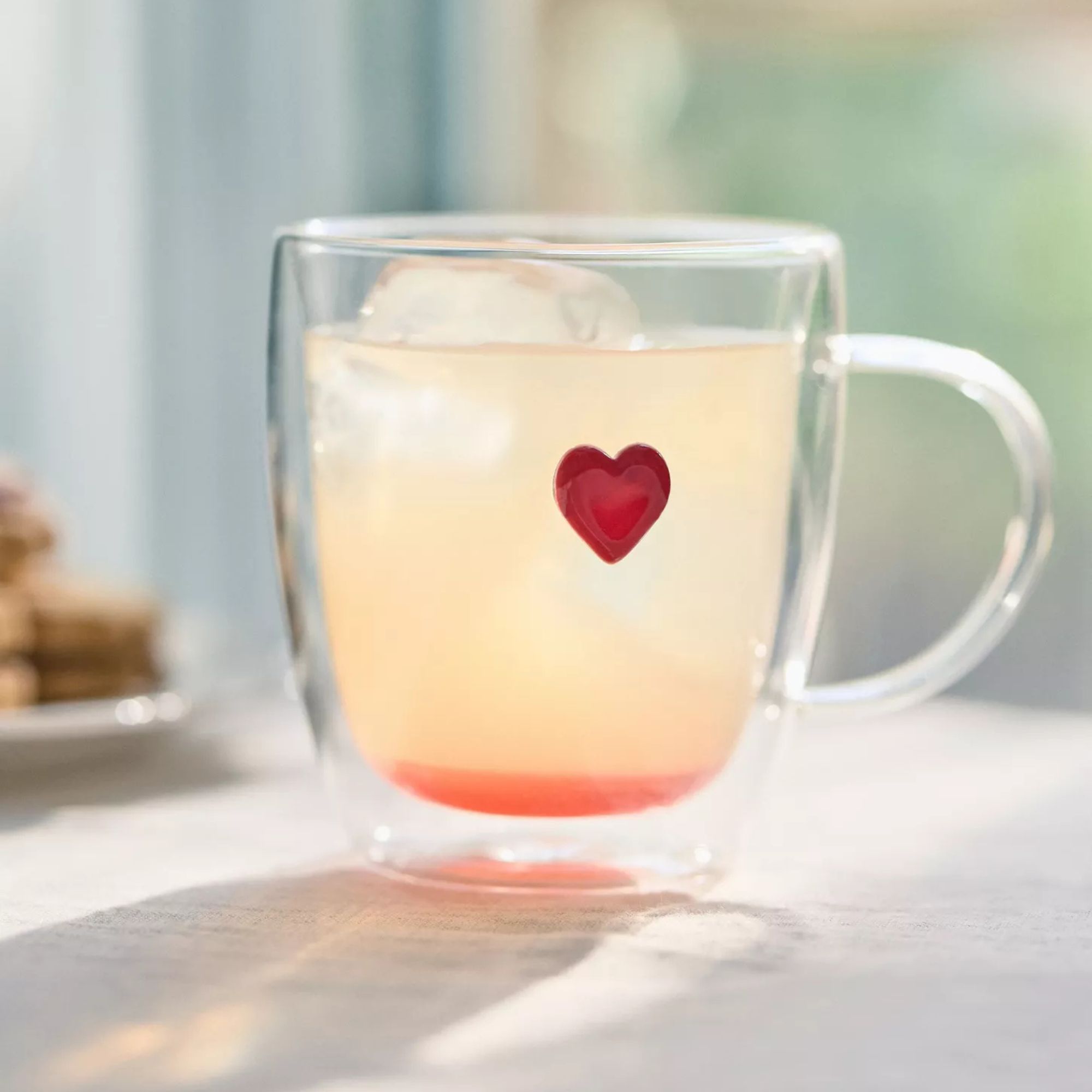 Glass mug with red heart design