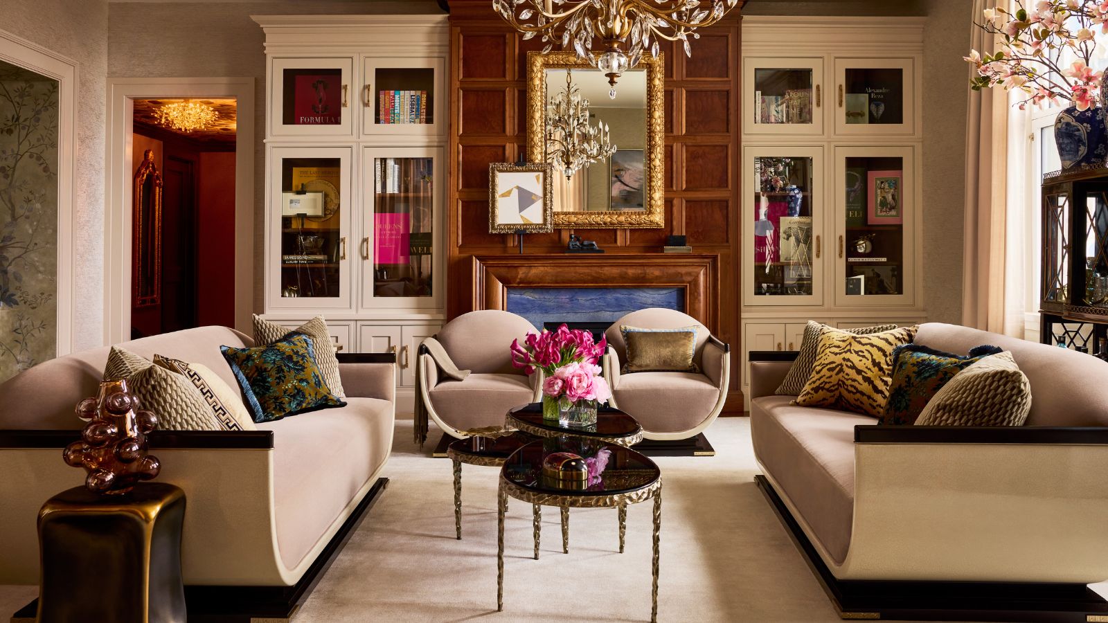 Luxury living room with neutral curved sofas and a chandelier