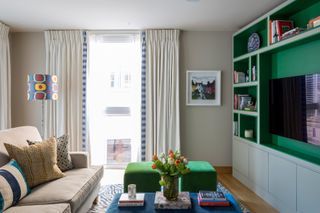 family room with built in units in green
