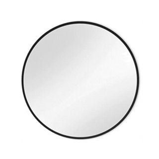 A circular wall mirror with a black border