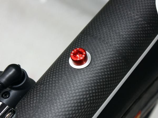 Small details include laser-etched alloy bottle hardware.