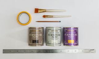 paint containers with brushes and scale