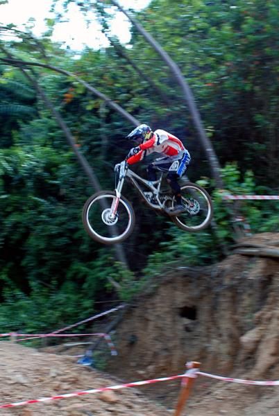 A rider in the elite men's downhill takes flight.