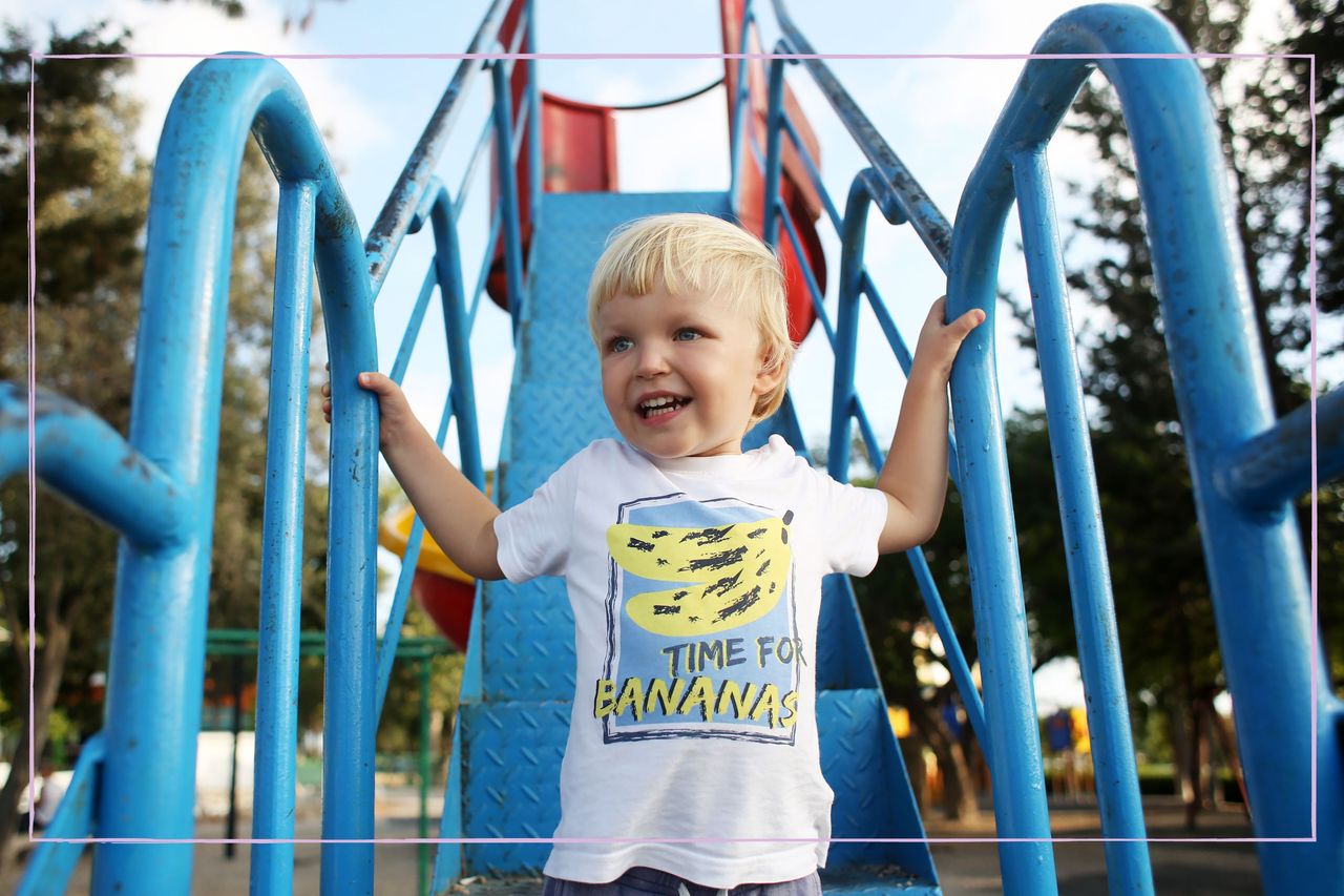 smiling boy on play equipment