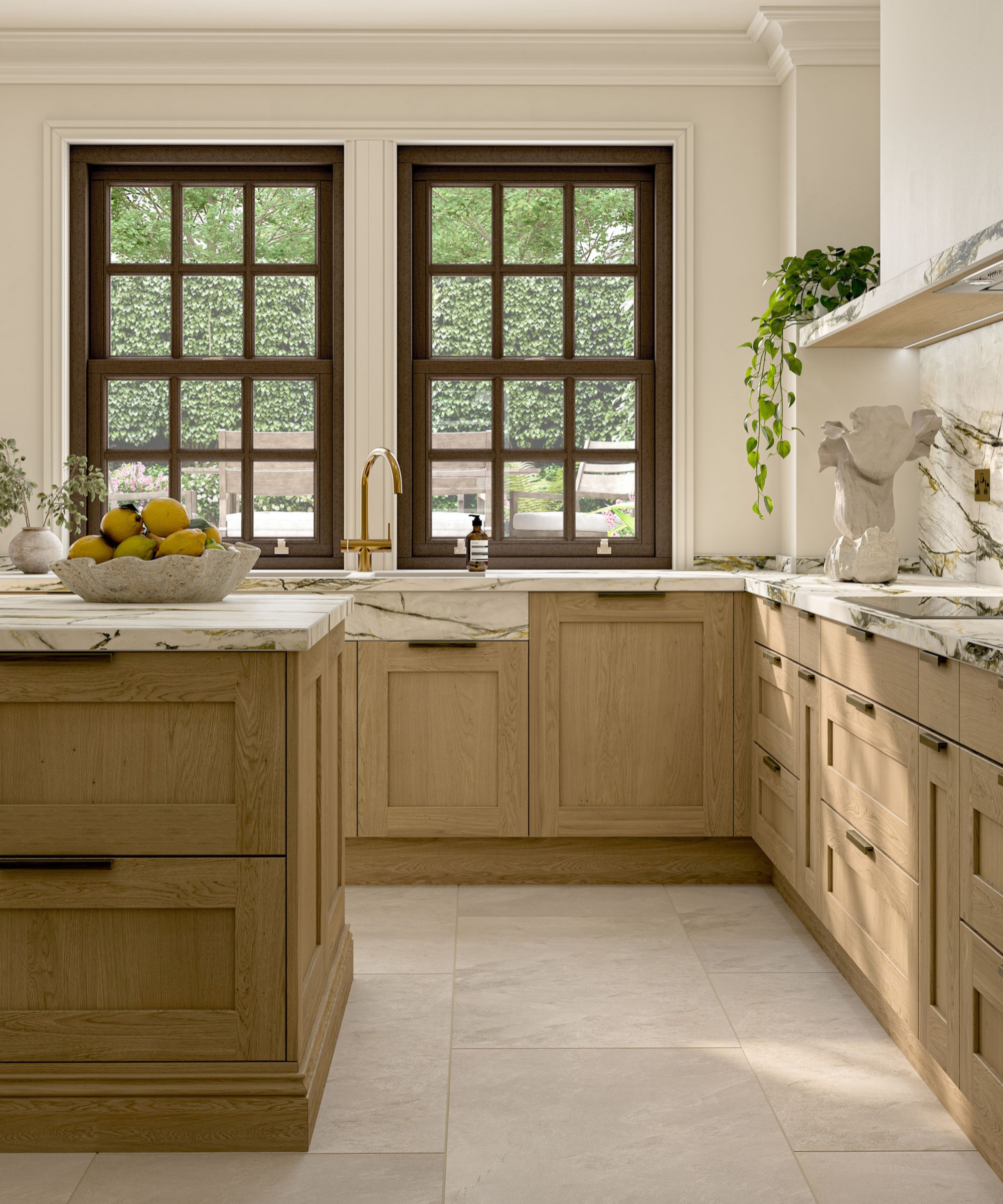Oak shaker kitchen with green-veined marble worktops, brass tap below dark sash windows and bowl of lemons on island