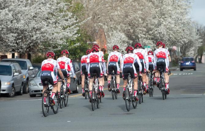 Its spring in Santa Rosa as the team heads out, framed by blossoming trees.