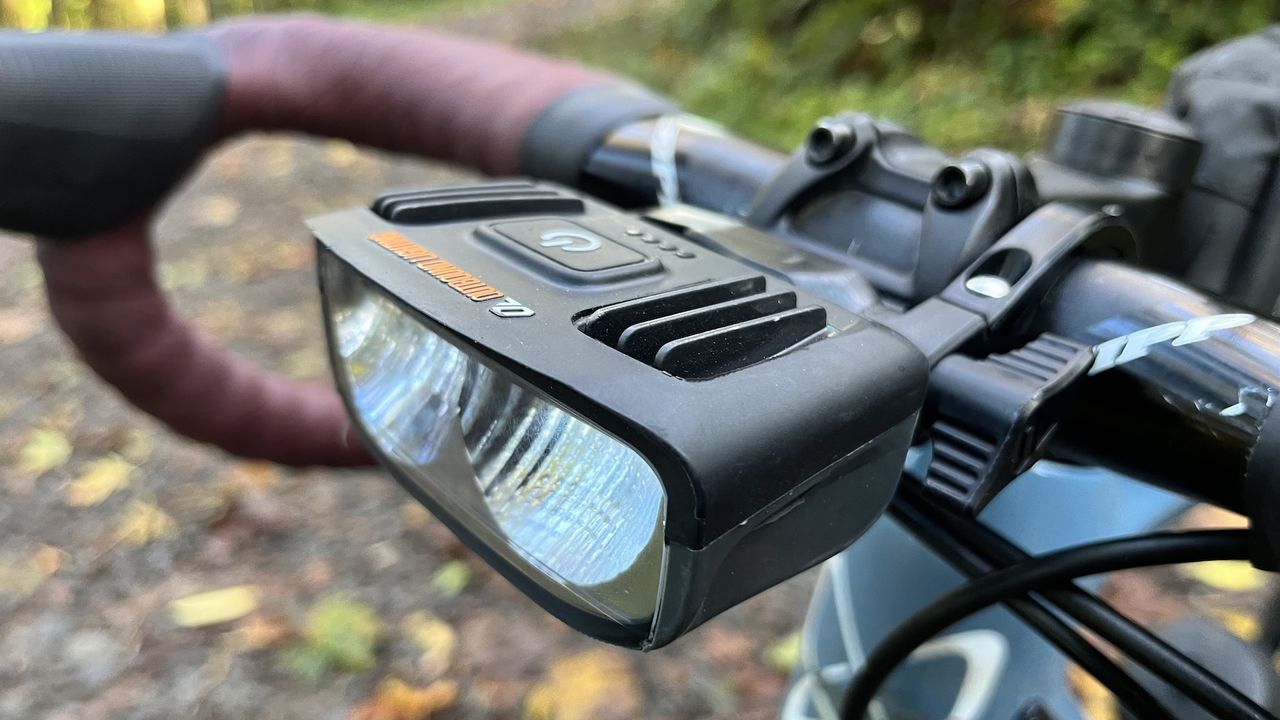 Image shows Outbound Lighting&#039;s Detour light mounted on a bike