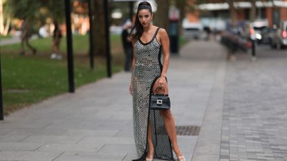 A guest in lace dress at Simone Rocha SS24 GettyImages-1687189606 Crop