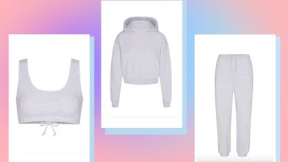 SKIMS cotton fleece bralette, hoodie and joggers on a pastel pink background