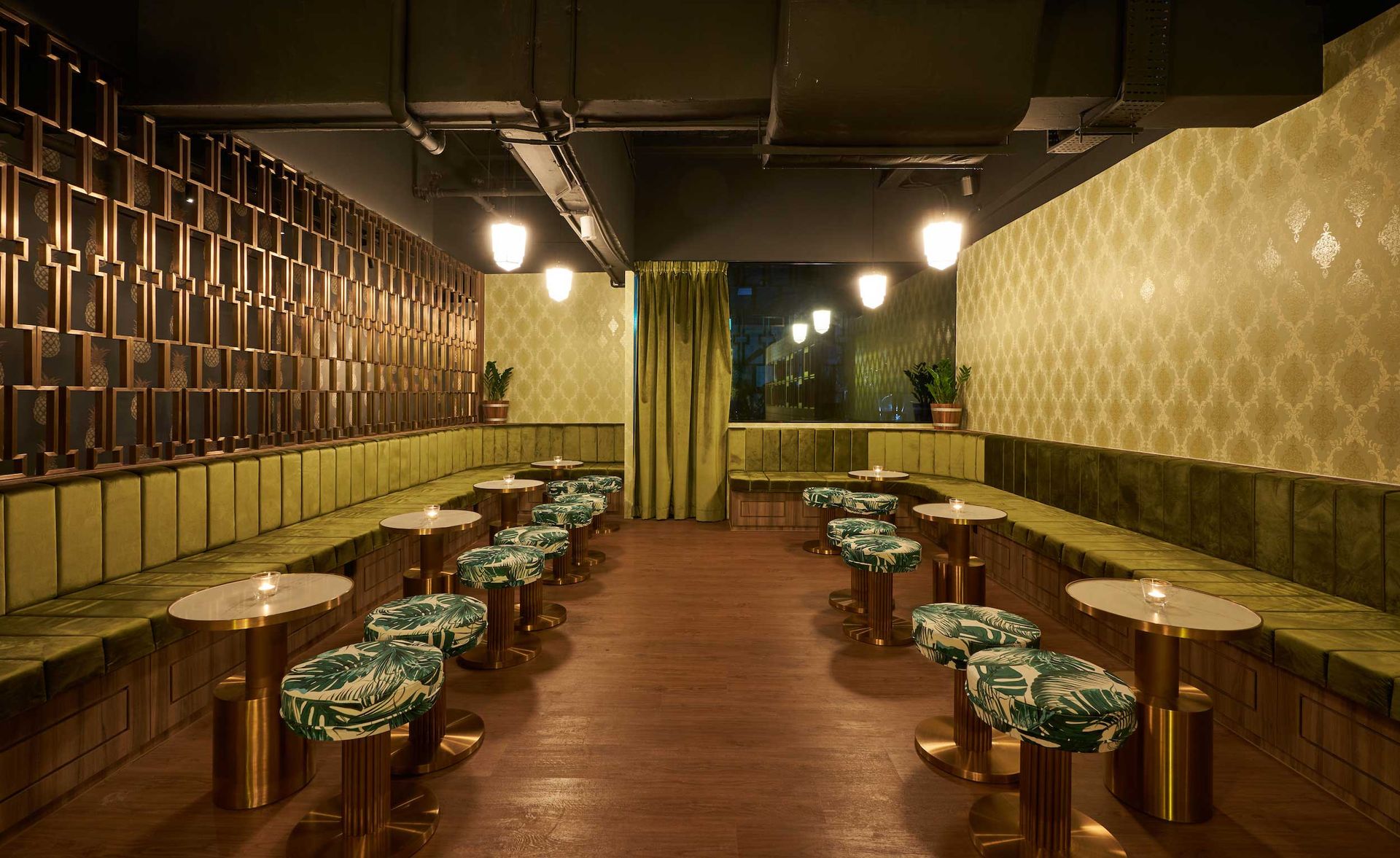 Seating area with long green benches & tables