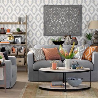 Modern grey living room ideas with ikat wallpaper and orange accents