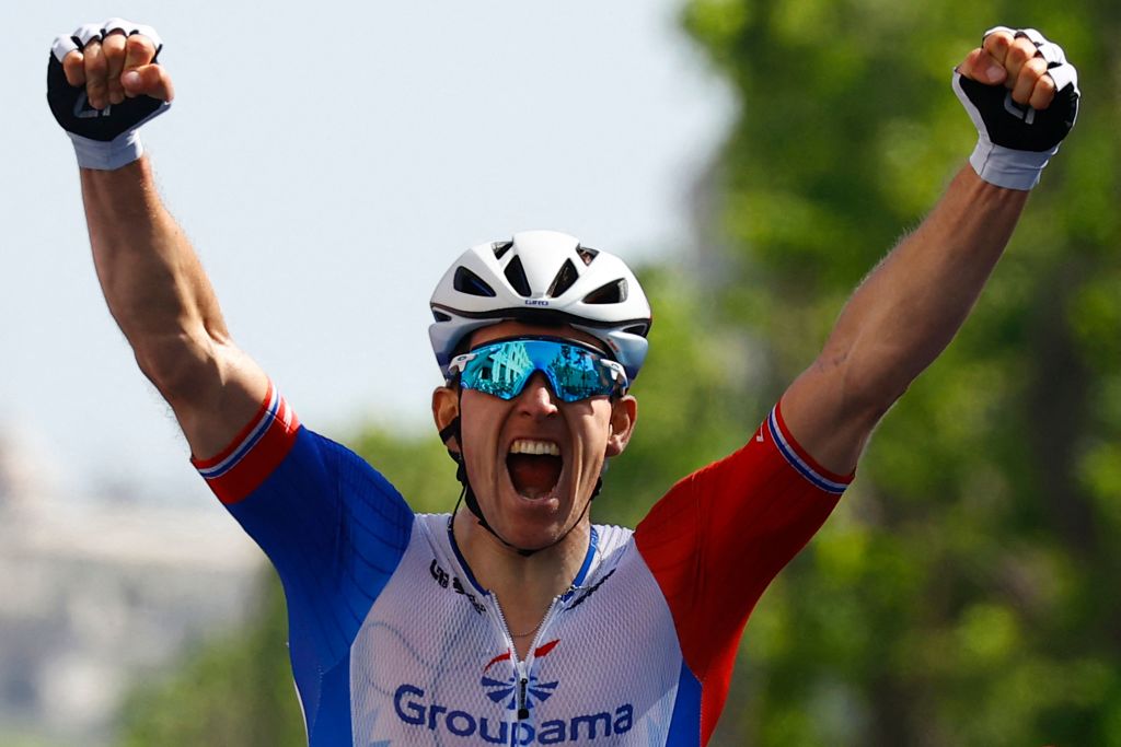 Team GroupamaFDJs French rider Arnaud Demare celebrates as he crosses the finish line to win the 4th stage of the Giro dItalia 2022 cycling race 174 kilometers between Catania and Messina Sicily on May 11 2022 Photo by Luca Bettini AFP Photo by LUCA BETTINIAFP via Getty Images