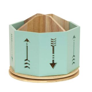 A mint colored wood rotating desk organizer