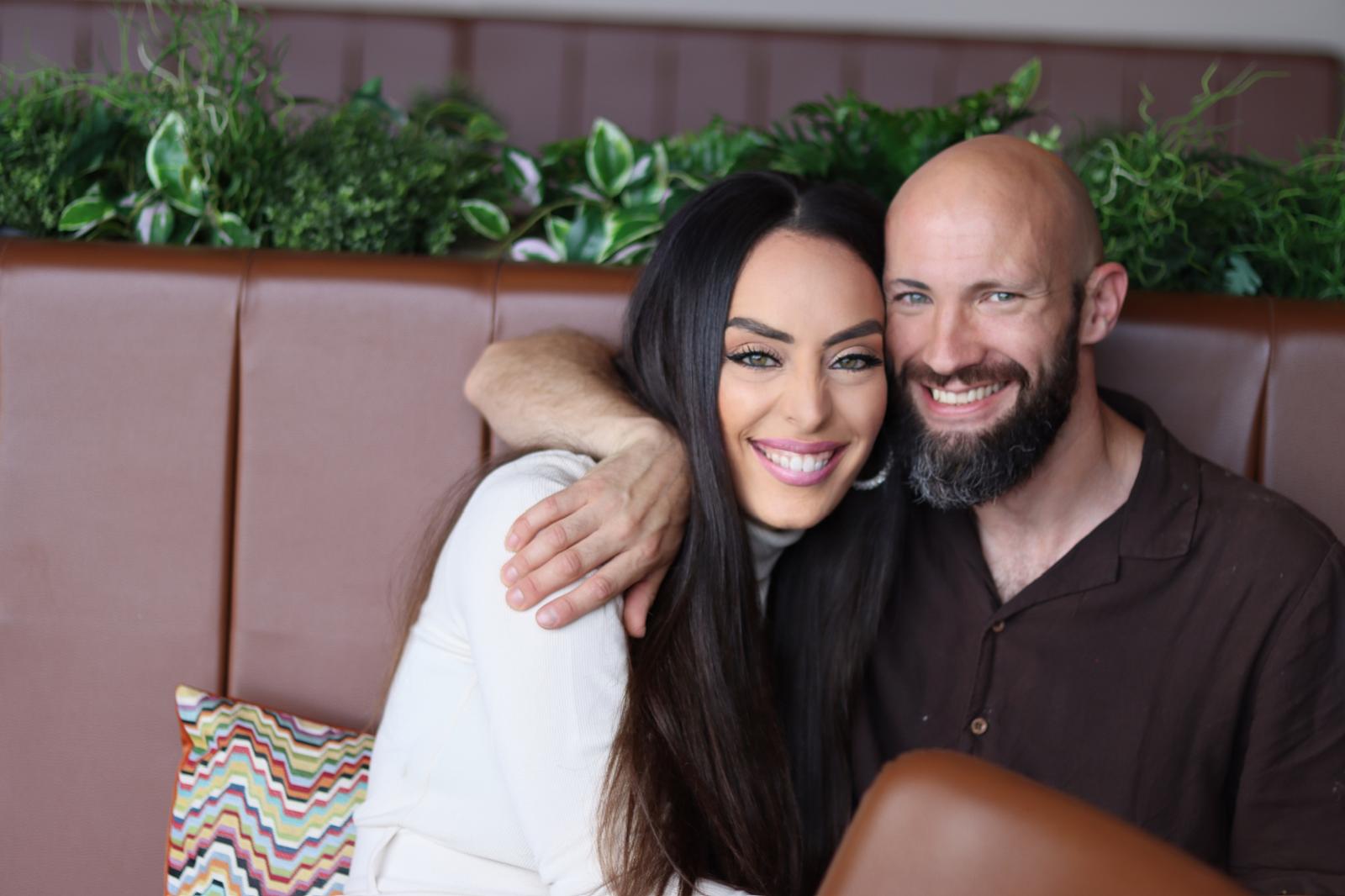 Couple pose for photo