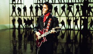 Elvis Presley performs with a Hagstrom Viking II