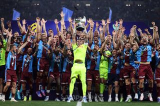 Trabzonspor players celebrate after winning the Turkish Super Cup in 2022.