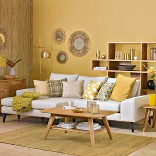 gen z yellow wall with shelving and sofa with cushions