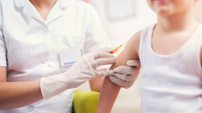 A child is vaccinated against measles