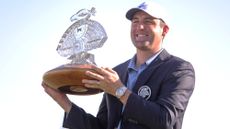 Winner Scottie Scheffler holds aloft the VM Phoenix Open trophy in 2023