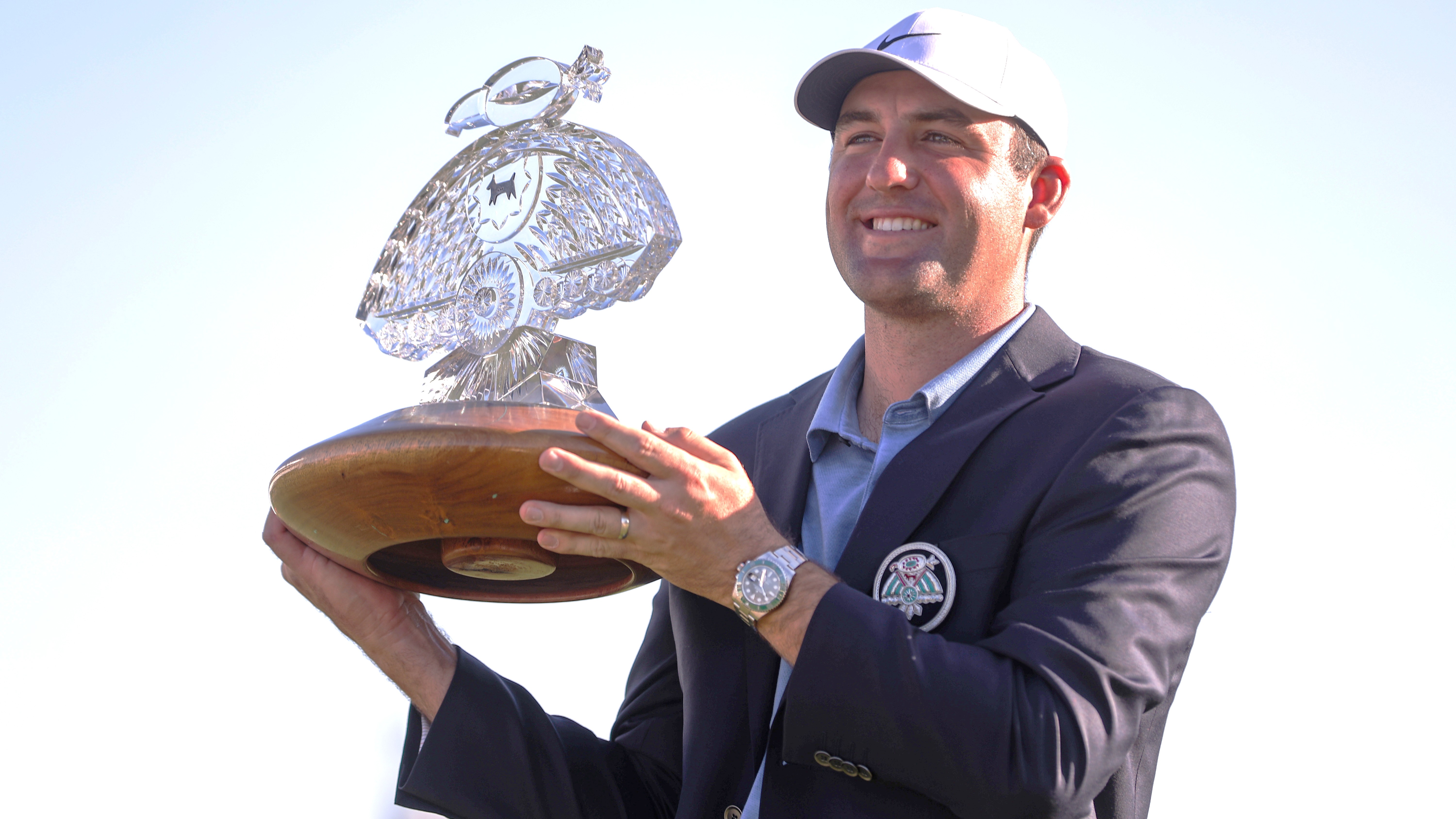Winner Scottie Scheffler holds aloft the VM Phoenix Open trophy in 2023